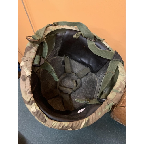 192 - A BRITISH ARMY CAMOUFLAGE HELMET