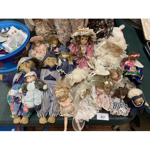 201 - A LARGE COLLECTION OF CHINA DOLLS OF VARYING SIZES