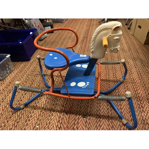 218 - A RETRO CHILD'S METAL BOUNCER WITH HORSES HEAD