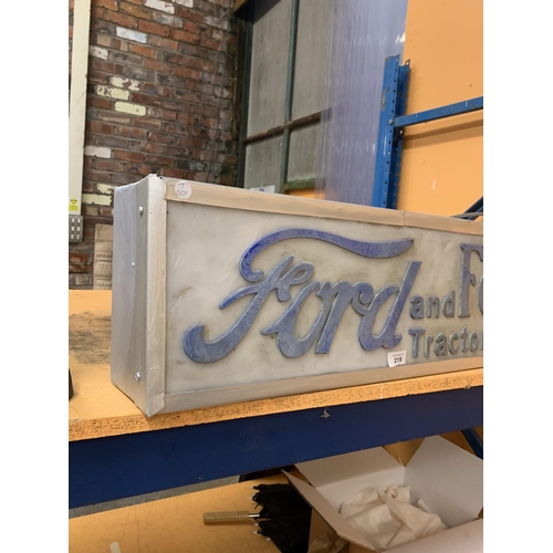 219 - AN ILLUMINATED 'FORD AND FORDSON TRACTOR SERVICES SIGN'