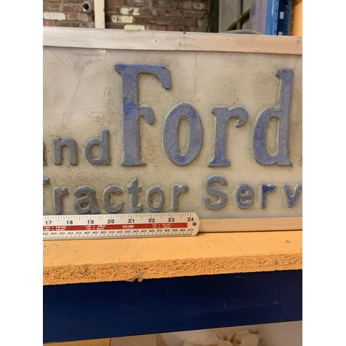 219 - AN ILLUMINATED 'FORD AND FORDSON TRACTOR SERVICES SIGN'