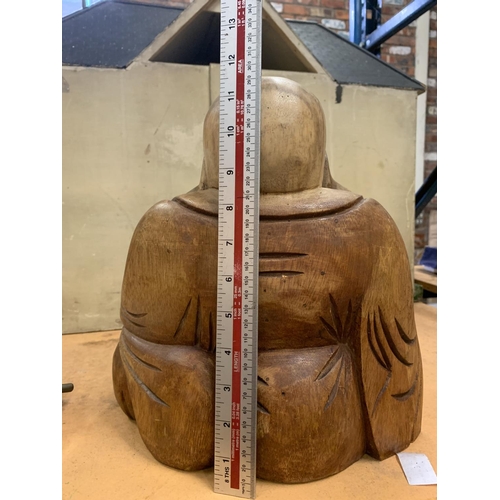 223 - A LARGE CARVED WOODEN BUDDHA