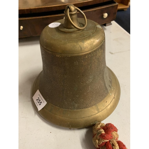 255 - A LARGE BRASS BELL WITH ROPE