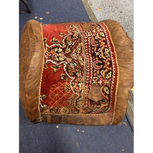 780 - A LARGE LEATHER CAMEL SADDLE WITH WOVEN DETAIL