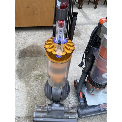 1676 - TWO VACUUM CLEANERS - A DYSON DC 40 AND A VAX