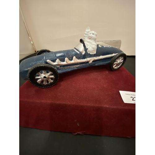 23 - A VINTAGE CAST MICHELIN MAN IN BLUE RACING CAR