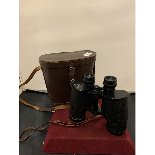 67 - A PAIR OF LEATHER CASED 10X50 FIELD BINOCULARS