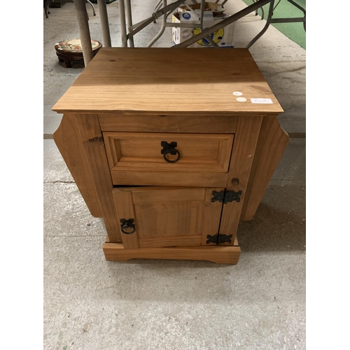 84A - A WOODEN SIDE TABLE/CABINET WITH MAGAZINE RACK