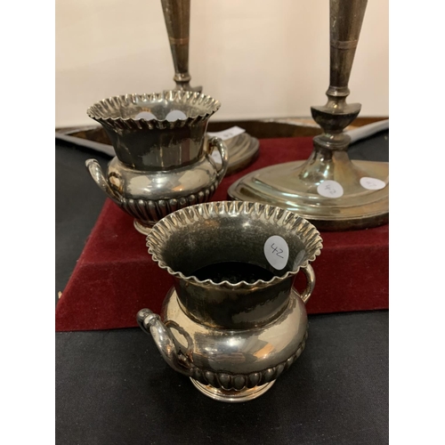 93 - A PAIR OF SILVER PLATED THREE BRANCH CANDELABRAS AND A PAIR OF SMALL URN SHAPED VASES