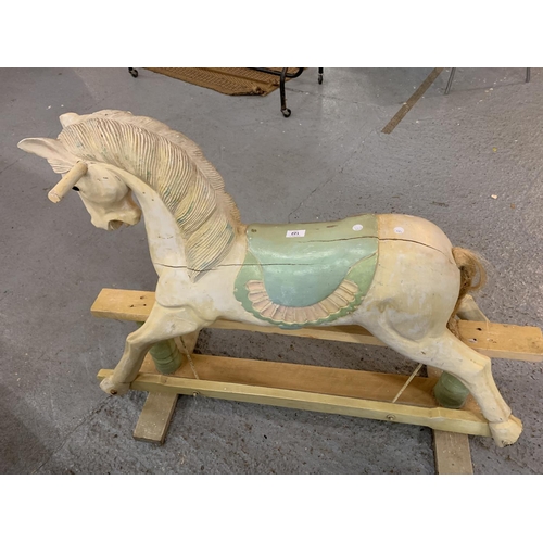 122 - A VINTAGE WOODEN CARVED ROCKING HORSE - HEIGHT TO SADDLE 65CMS