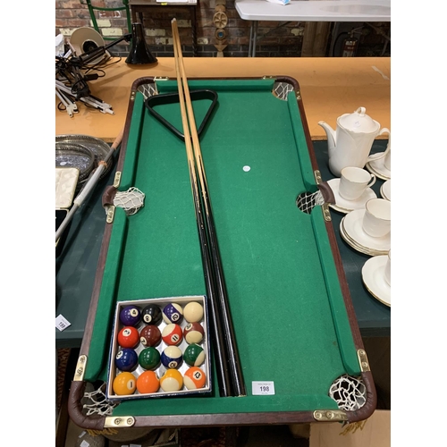 198 - A TABLE TOP SNOOKER TABLE TO INCLUDE TWO CUES AND A SET OF SNOOKER BALLS