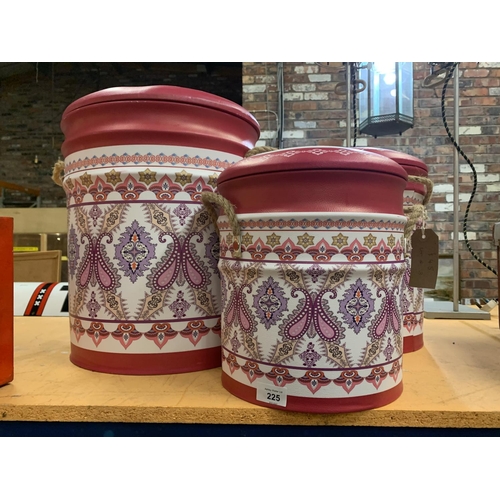 225 - A SET OF THREE VARIOUS SIZED DECORATIVE PINK LAUNDRY/STORAGE BINS