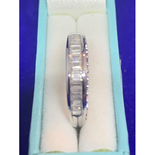 542 - A SILVER RING MARKED 925 WITH INLINE CLEAR STONES SIZE N IN A PRESENTATION BOX