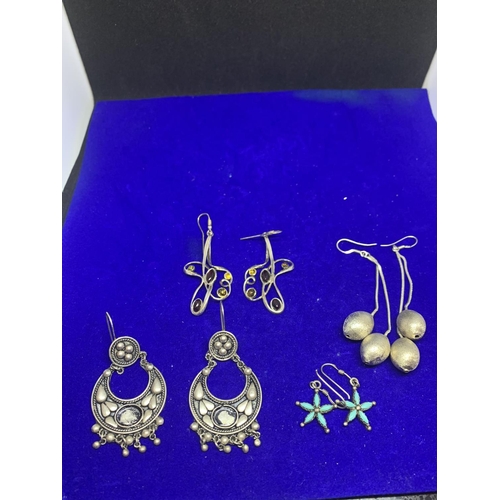 582 - FOUR PAIRS OF LARGE SILVER DROP EARRINGS