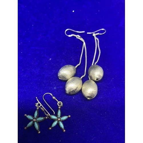 582 - FOUR PAIRS OF LARGE SILVER DROP EARRINGS