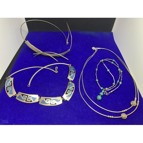 584 - FOUR SILVER CHOCKER STYLE NECKLACES TO INCLUDE A MEXICAN DESIGN, ABSTRACT ETC