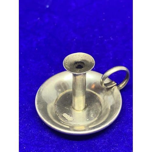 609 - A WHITE METAL MINATURE CANDLESTICK POSSIBLY SILVER