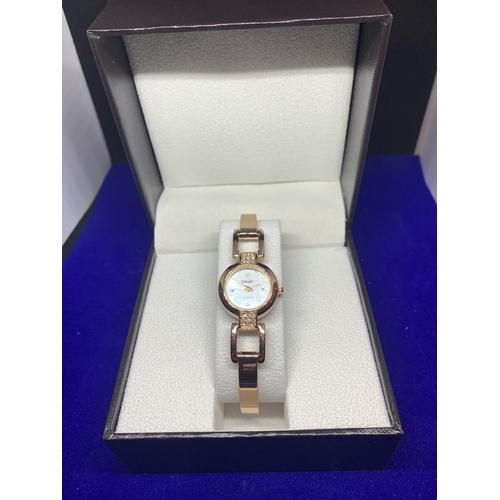 661 - A PINK METAL LADIES WRIST WATCH BOXED AND NEW