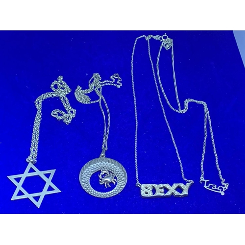 662 - FOUR SILVER NECKLACES ONE DEPICTING A CRAB, TRACY, SEXY AND A STAR OF DAVID ALL MARKED