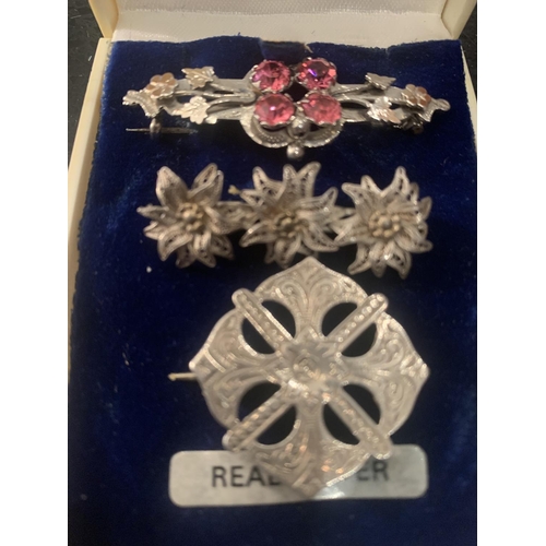 691 - THREE SILVER BROOCHES