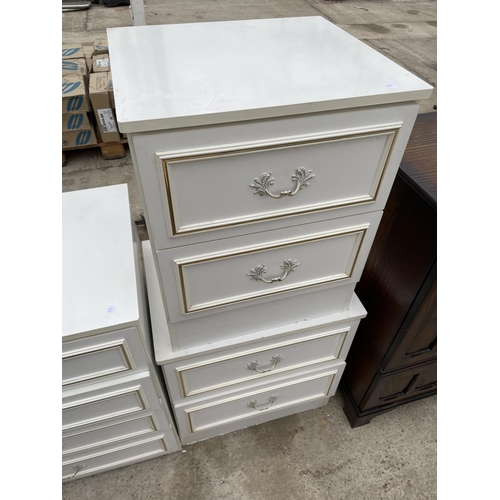 2406 - A PAIR OF CREAM/GILT BEDSIDE CHESTS AND FOUR DRAWER CHEST