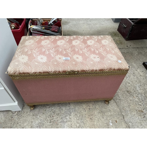 2423 - A LLOYD LOOM STYLE OTTOMAN