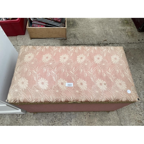 2423 - A LLOYD LOOM STYLE OTTOMAN