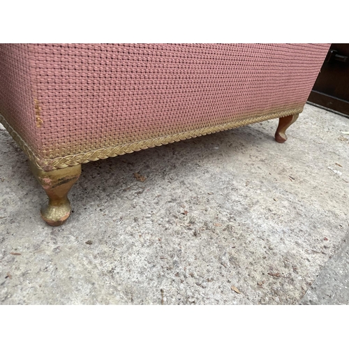 2423 - A LLOYD LOOM STYLE OTTOMAN