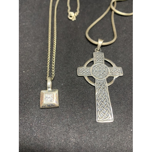 507 - FOUR SILVER NECKLACES MARKED 925 WITH PENDANTS TO INCLUDE A CROSS, TOOTH, CLEAR STONE AND PINK STONE