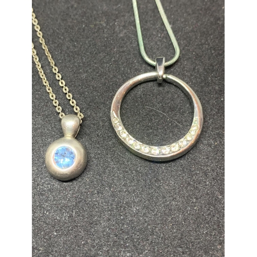 508 - FOUR SILVER NECKLACES MARKED 925 WITH PENDANTS TO INCLUDE A CLEAR STONE CIRCLE, A CELTIC DESIGN, A B... 