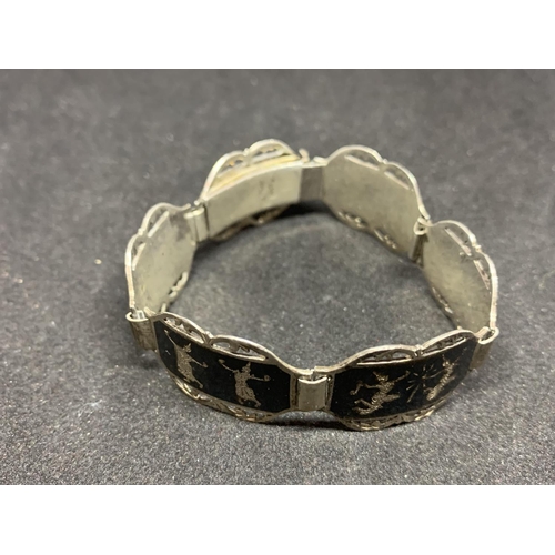 513 - A SIAM SILVER BRACELET MARKED