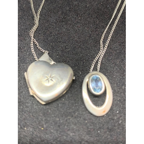 520 - FOUR SILVER NECKLACES MARKED 925 WITH PENDANTS TO INCLUDE A HEART LOCKET, AN OVAL WITH BLUE STONE AN... 