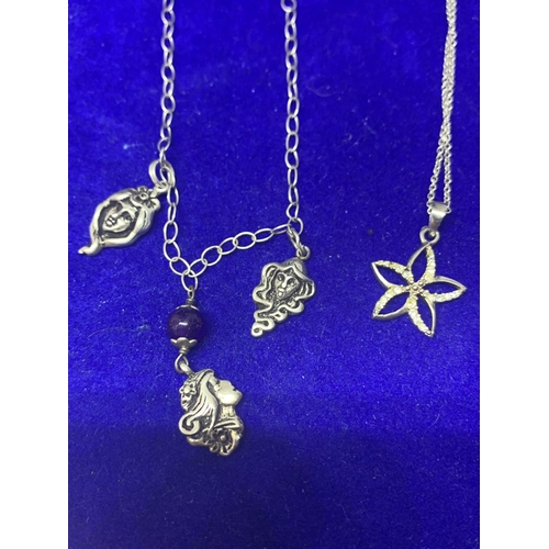 533 - FOUR SILVER NECKLACES WITH PENDANTS TO INCLUDE A ST CHRISTOPHER, BLUE CAMEO, FLOWER ETC