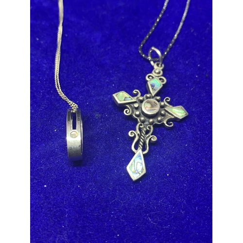 540 - FOUR SILVER NECKLACES MARKED 925 WITH PENDANTS TO INCLUDE A CROSS, TEARDROP STYLE, BLUE STONE AND AN... 