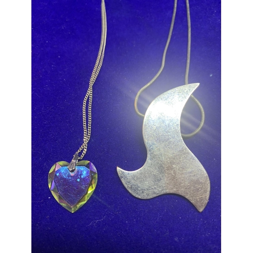 545 - FOUR SILVER NECKLACES MARKED 925 WITH PENDANTS TO INCLUDE A LOCKET, SHELL TEARDROP, HEART AND AN ABS... 