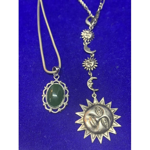 550 - FOUR SILVER NECKLACES MARKED 925 WITH PENDANTS TO INCLUDE MOON AND SUN, PEARL, GREEN STONE AND CLEAR... 