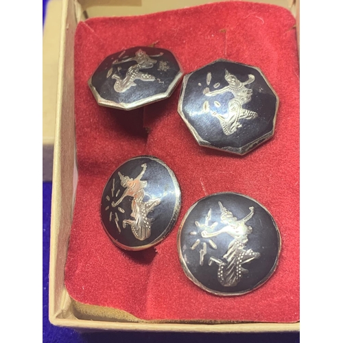 556 - TWO PAIRS OF SIAM SILVER CUFFLINKS IN A PRESENTATION BOX