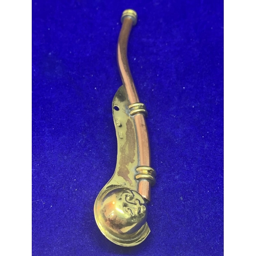 564 - A BRASS AND COPPER BOSSONS WHISTLE