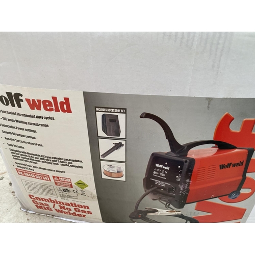 1262 - AN AS NEW AND BOXED WOLF WELDER TO INCLUDE WELDING RODS