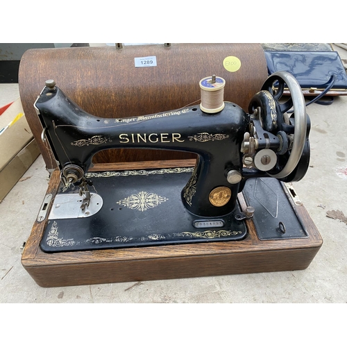 1289 - A VINTAGE SINGER SEWING MACHINE COMPLETE WITH CASE