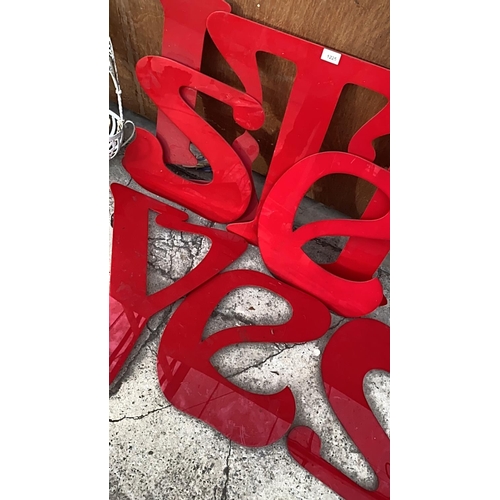 1225 - AN ASSORTMENT OF RED PERSPEX SIGN MAKING LETTERS