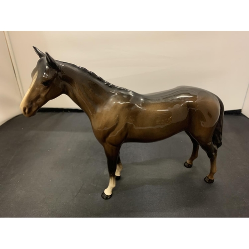 718 - A BESWICK BROWN STALLION