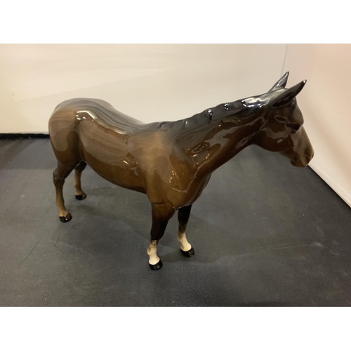 718 - A BESWICK BROWN STALLION