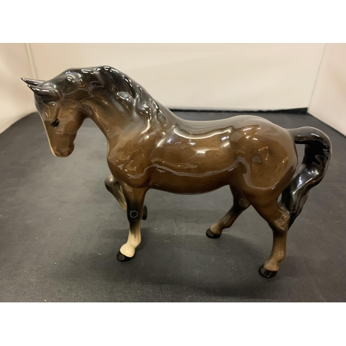 722 - A BESWICK TROTTING HORSE