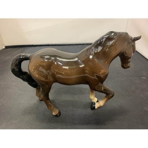 722 - A BESWICK TROTTING HORSE