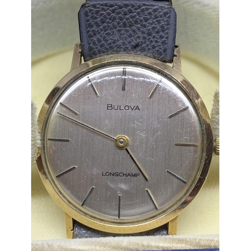 583 - A BULOVA LONGCHAMP 9 CARAT GOLD WRISTWATCH ENGRAVED IN WORKING ORDER WITH PRESENTATION BOX