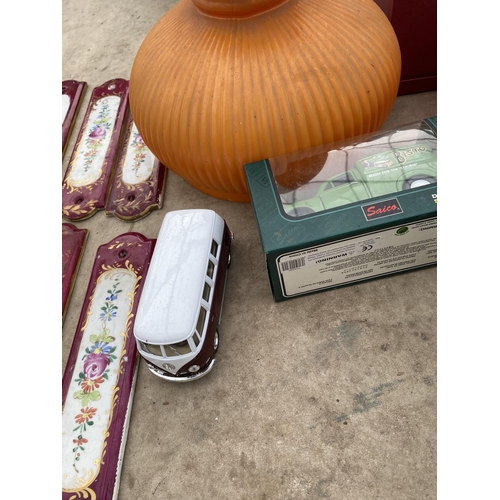 1303 - AN ASSORTMENT OF ITEMS TO INCLUDE LAMP SHADES,A VINTAGE TIN AND A TEA SET ETC