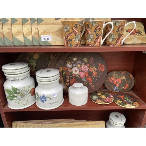 1346 - A LARGE COLLECTION OF KITCHEN ITEMS TO INCLUDE CUPS AND SAUCERS, PLACE MATS AND MUGS ETC