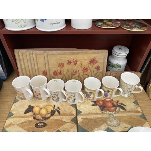 1346 - A LARGE COLLECTION OF KITCHEN ITEMS TO INCLUDE CUPS AND SAUCERS, PLACE MATS AND MUGS ETC