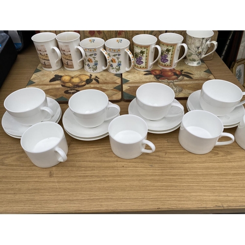 1346 - A LARGE COLLECTION OF KITCHEN ITEMS TO INCLUDE CUPS AND SAUCERS, PLACE MATS AND MUGS ETC